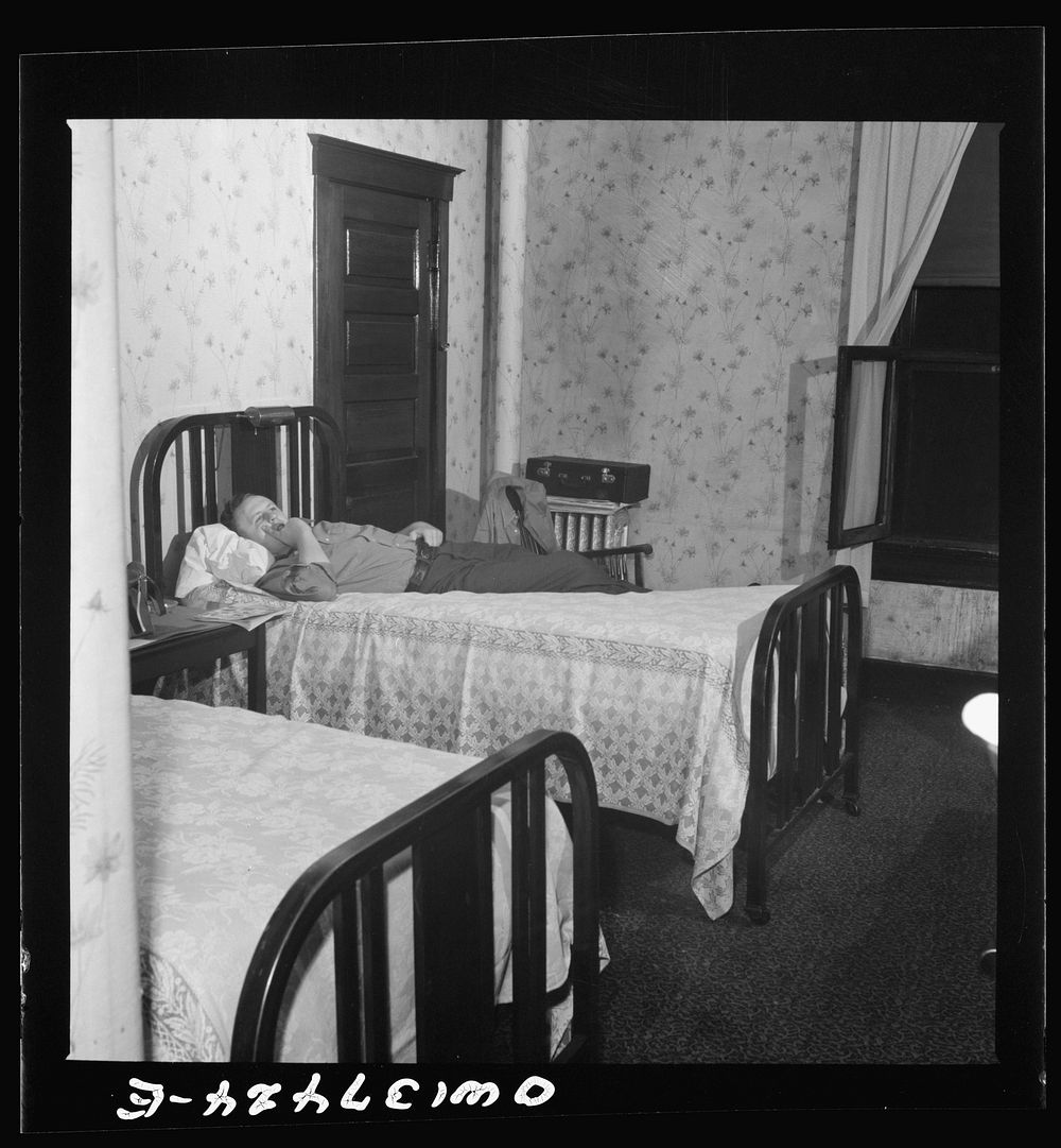 Pittsburgh, Pennsylvania. Hotel room where Clem Carson, a Greyhound driver, lives and which he shares with another bus…