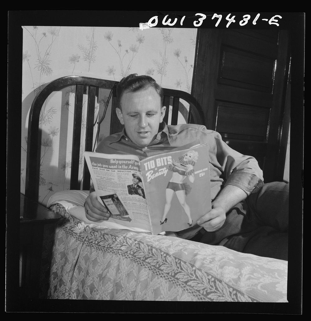 Pittsburgh, Pennsylvania. Clem Carson, a Greyhound bus driver, reading one of his favorite magazines. He and his roommate…