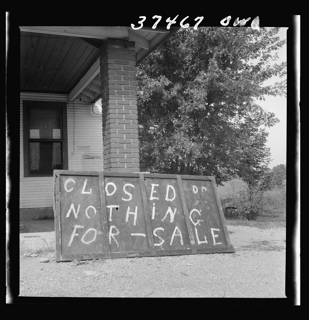 A sign in front of a former gas station on the road between Columbus and Cincinnati, Ohio. Sourced from the Library of…