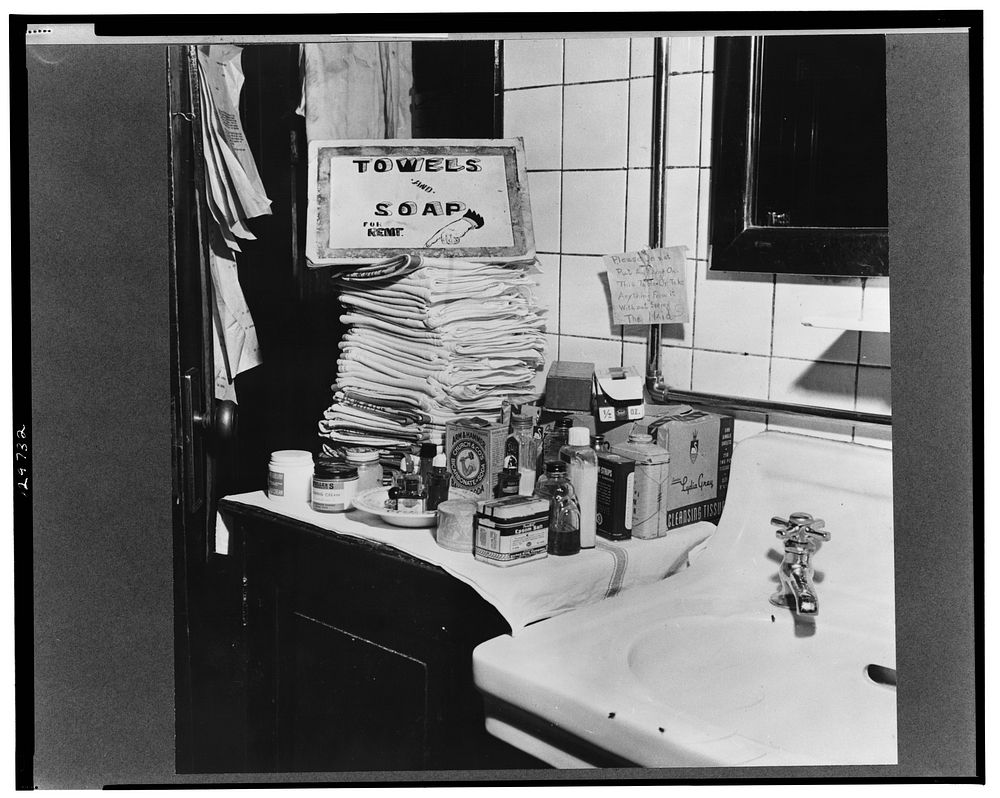 Chicago, Illinois. Bus passengers in the Greyhound bus terminal's ladies' restroom. Items ranging from soap and nail polish…