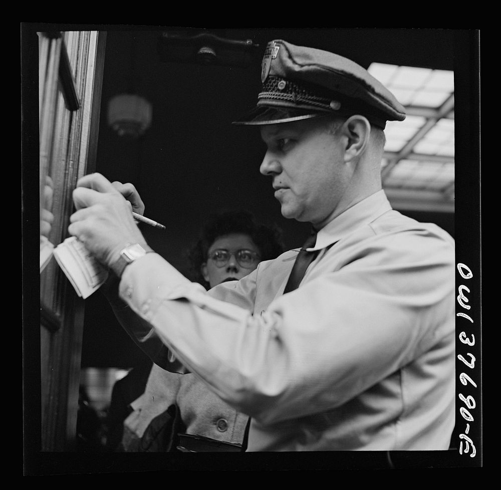 [Untitled photo, possibly related to: Chicago, Illinois. A bus driver punching tickets]. Sourced from the Library of…