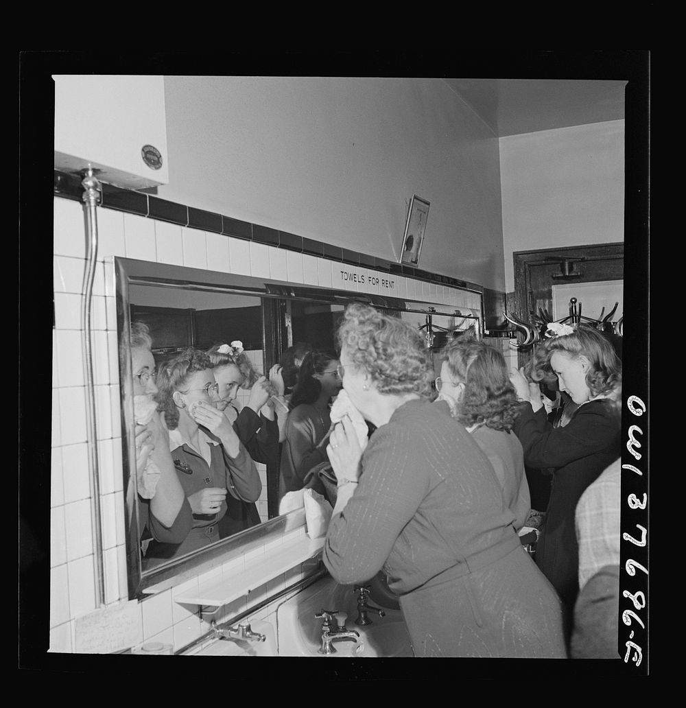 Chicago, Illinois. Passengers freshening up in the ladies' restroom at the Greyhound bus terminal. Sourced from the Library…