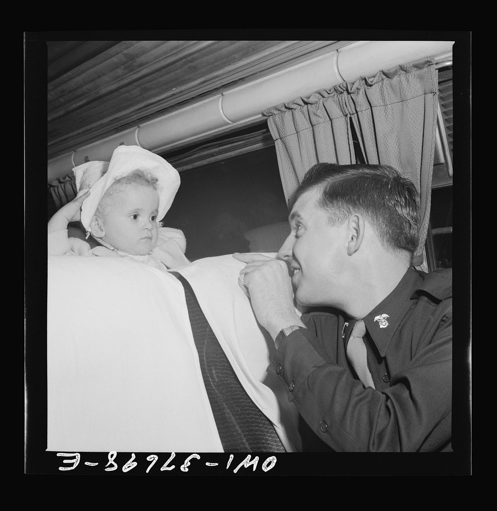 A lieutenant getting acquainted with one of the passengers on a Greyhound bus enroute from Cincinnati, Ohio to Louisville…