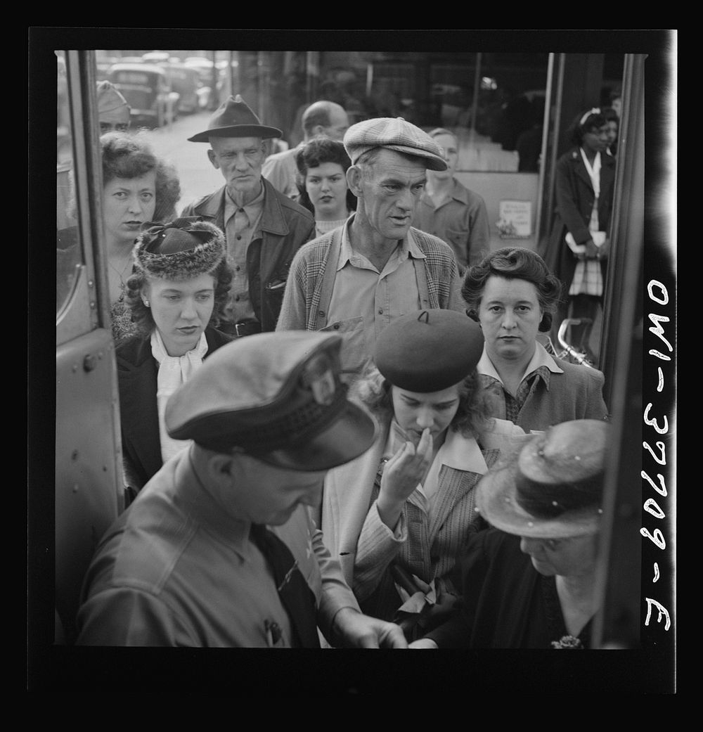 People boarding a Greyhound bus at a small town between Chicago, Illinois and Cincinnati, Ohio. Sourced from the Library of…