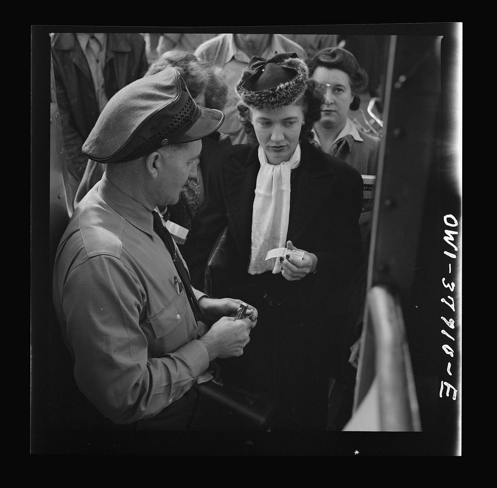 People boarding a Greyhound bus at a small town between Chicago, Illinois and Cincinnati, Ohio. Sourced from the Library of…