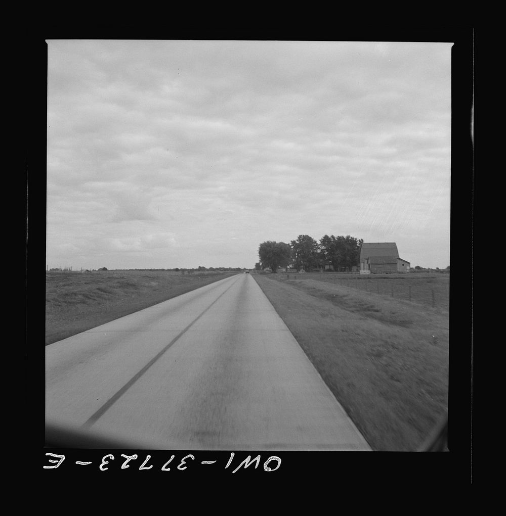 A highway which was formerly crowded with traffic in Indiana as seen from a Greyhound bus. Sourced from the Library of…