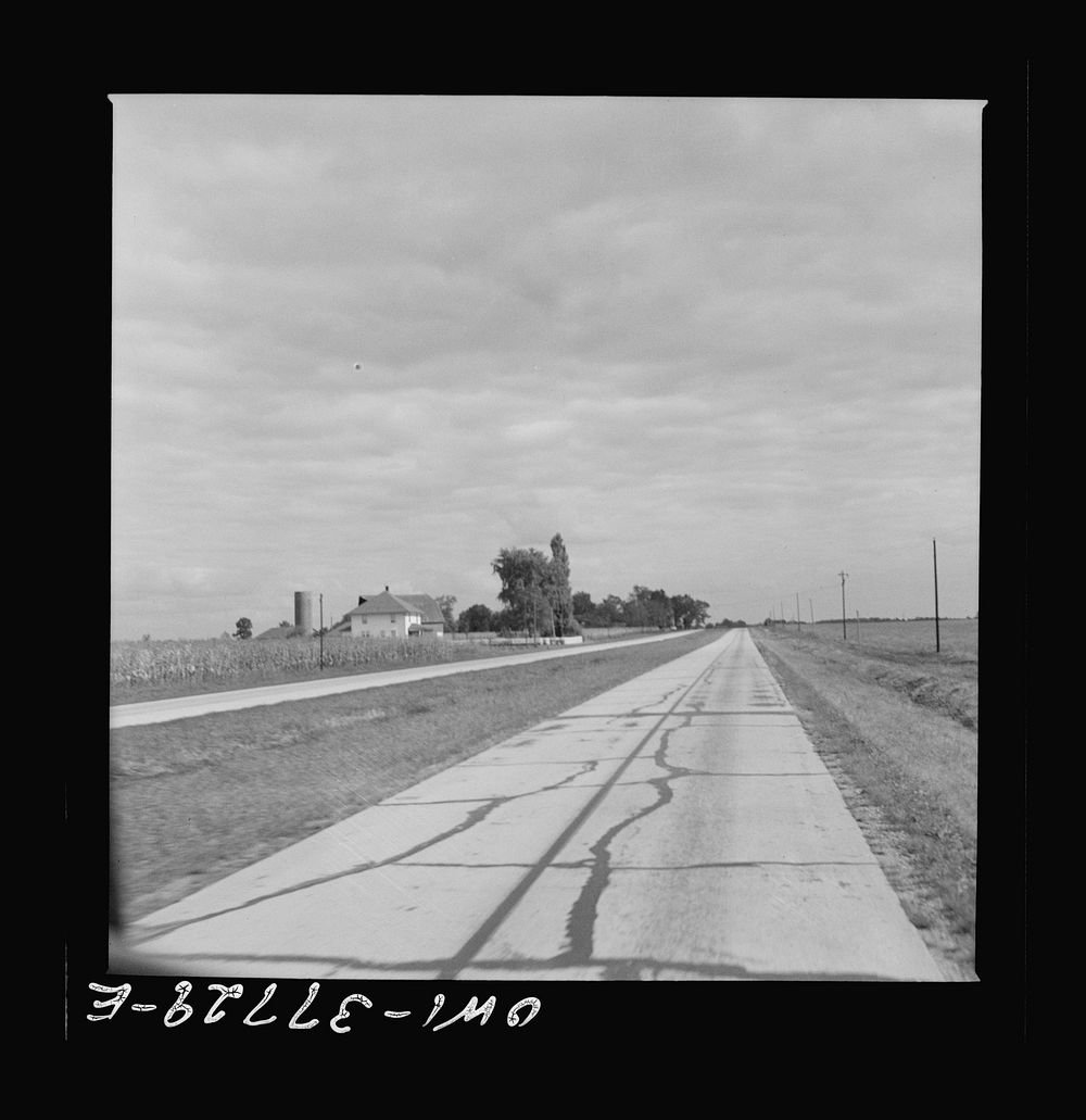 A highway which was formerly crowded with traffic in Indiana as seen from a Greyhound bus. Sourced from the Library of…