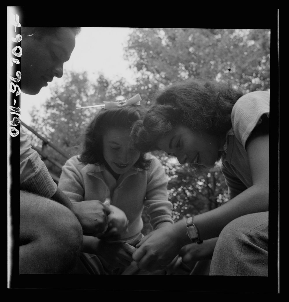 Interracial activities at Camp Ellen Marvin, where children are aided by the Methodist Camp Service. Campers helping with…