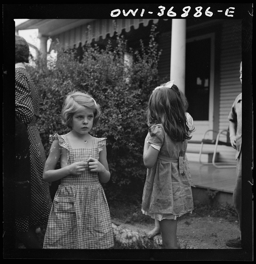 Children watching a Greyhound bus that broke down in a small town in Pennsylvania on the way to Pittsburgh from Washington…