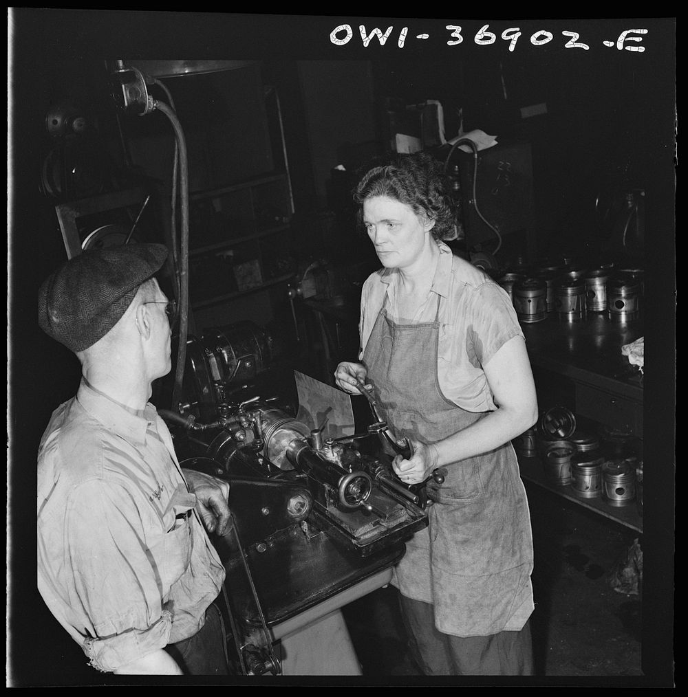 Pittsburgh, Pennsylvania. One of the women employees in the machine shop of the Greyhound garage working on a cylinder…