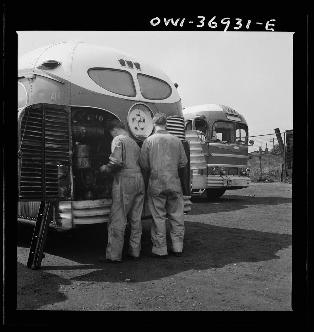 [Untitled photo, possibly related to: Pittsburgh, Pennsylvania. Mechanics working on a bus parked outside the Greyhound…