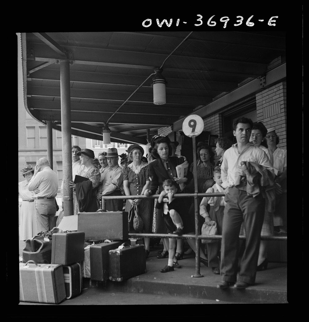 [Untitled photo, possibly related to: Pittsburgh, Pennsylvania. Passengers waiting for a bus to pull up to the loading…