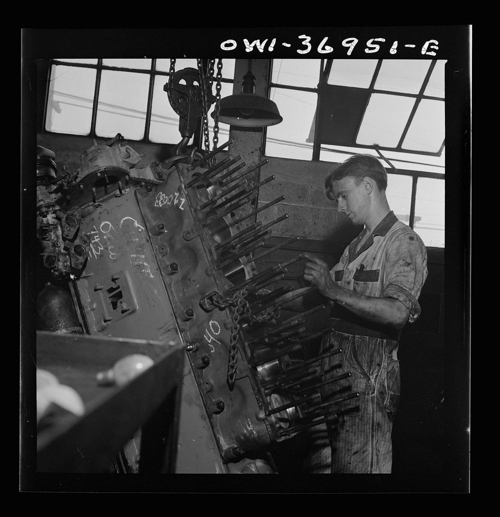 [Untitled photo, possibly related to: Pittsburgh, Pennsylvania. Mechanic working on a bus engine at the garage]. Sourced…