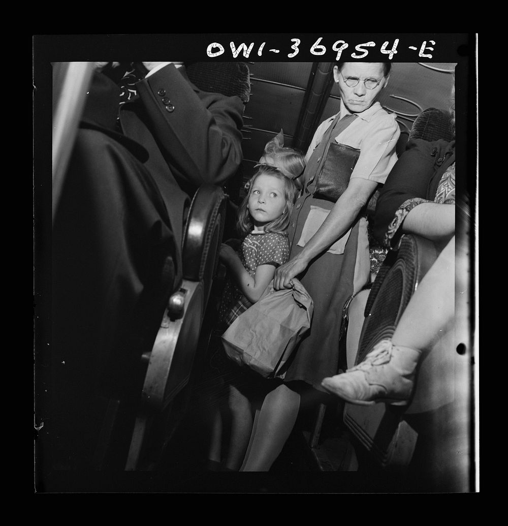 Passengers standing in the aisle of a Greyhound bus going from Washington, D.C. to Pittsburgh, Pennsylvania. Sourced from…
