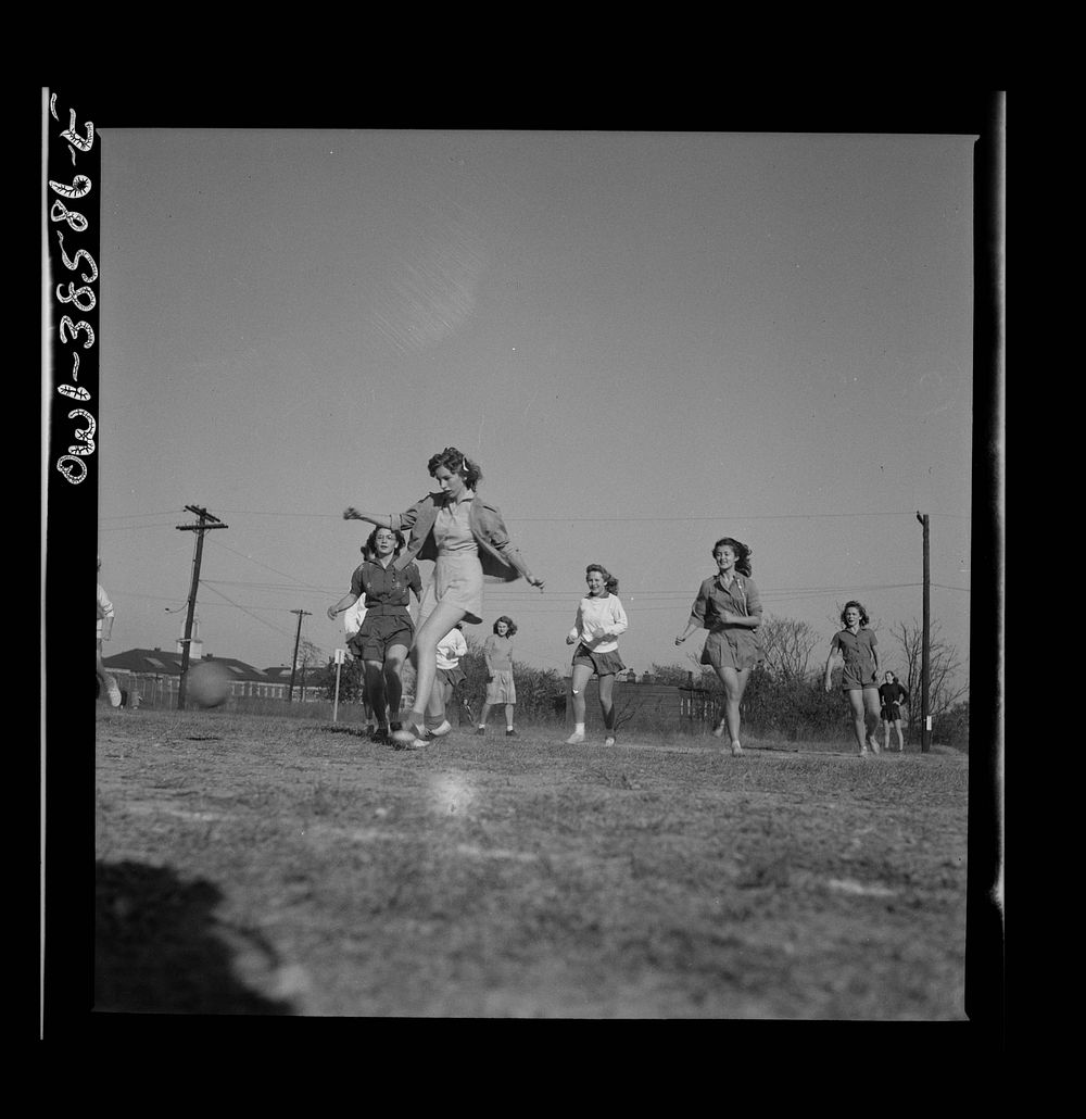 [Untitled photo, possibly related to: Washington, D.C. Playing soccer in a physical education class at Woodrow Wilson High…
