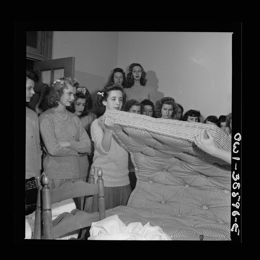 Washington, D.C. Students in a home management class at Woodrow Wilson High School showing how to turn a mattress. The…