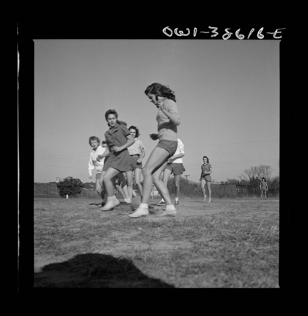 Washington, D.C. Playing soccer in a physical education class at Woodrow Wilson High School. Sourced from the Library of…