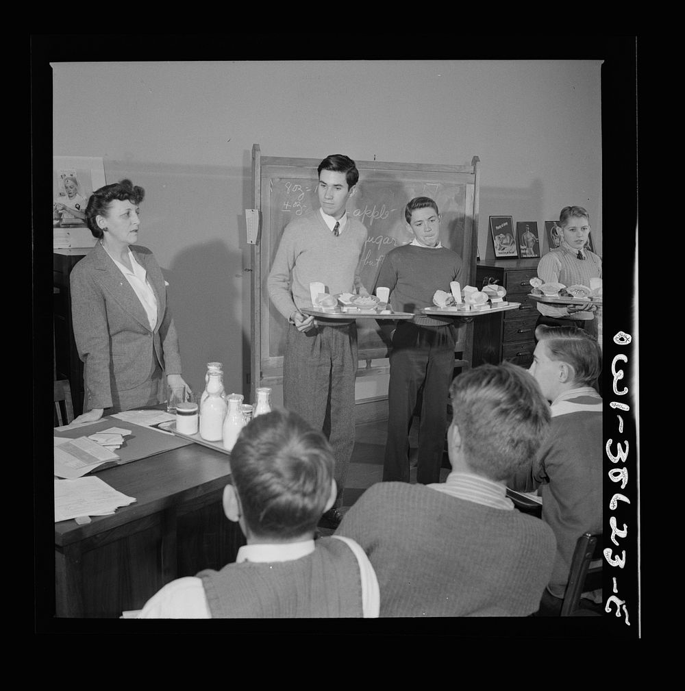 Washington, D.C. Mrs. Mary Spangler teaching a boys' class in nutrition at Woodrow Wilson High School. Sourced from the…