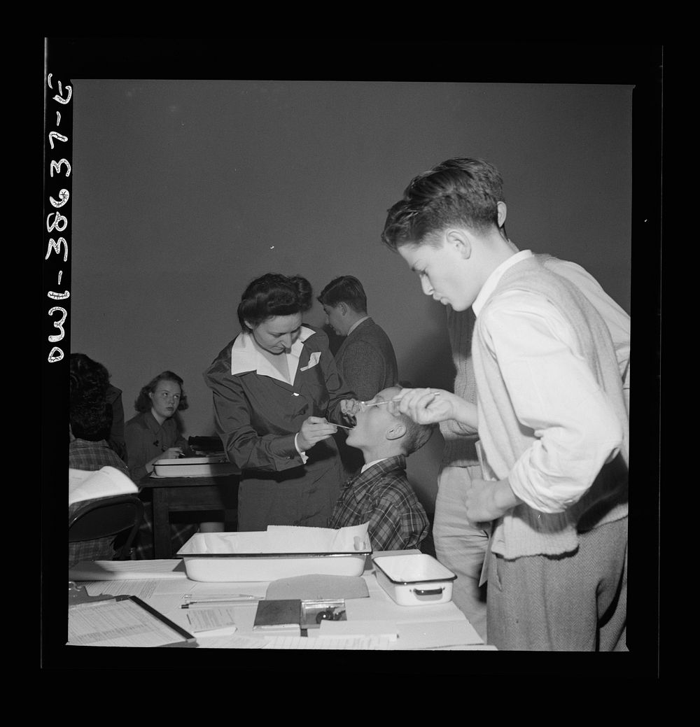 Each year a dental examination is given to all students at Wilson High School. Washington, D.C.. Sourced from the Library of…