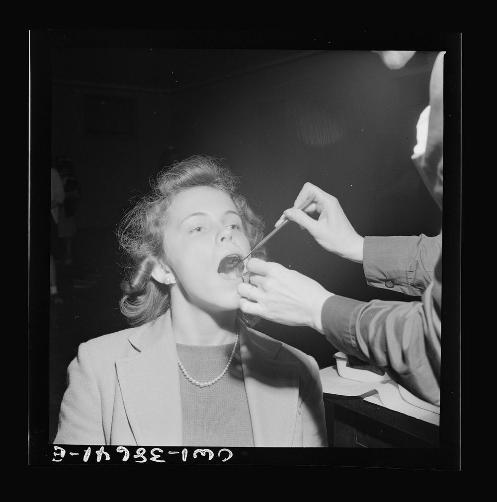 Washington, D.C. Examining students' teeth, an annual procedure at Wilson High School. Sourced from the Library of Congress.