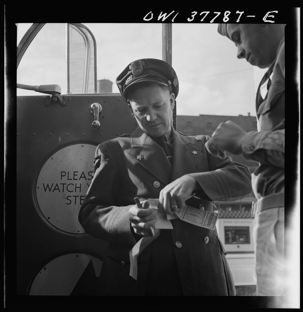 Chicago, Illinois. A bus driver collecting tickets at the Greyhound bus terminal. Sourced from the Library of Congress.