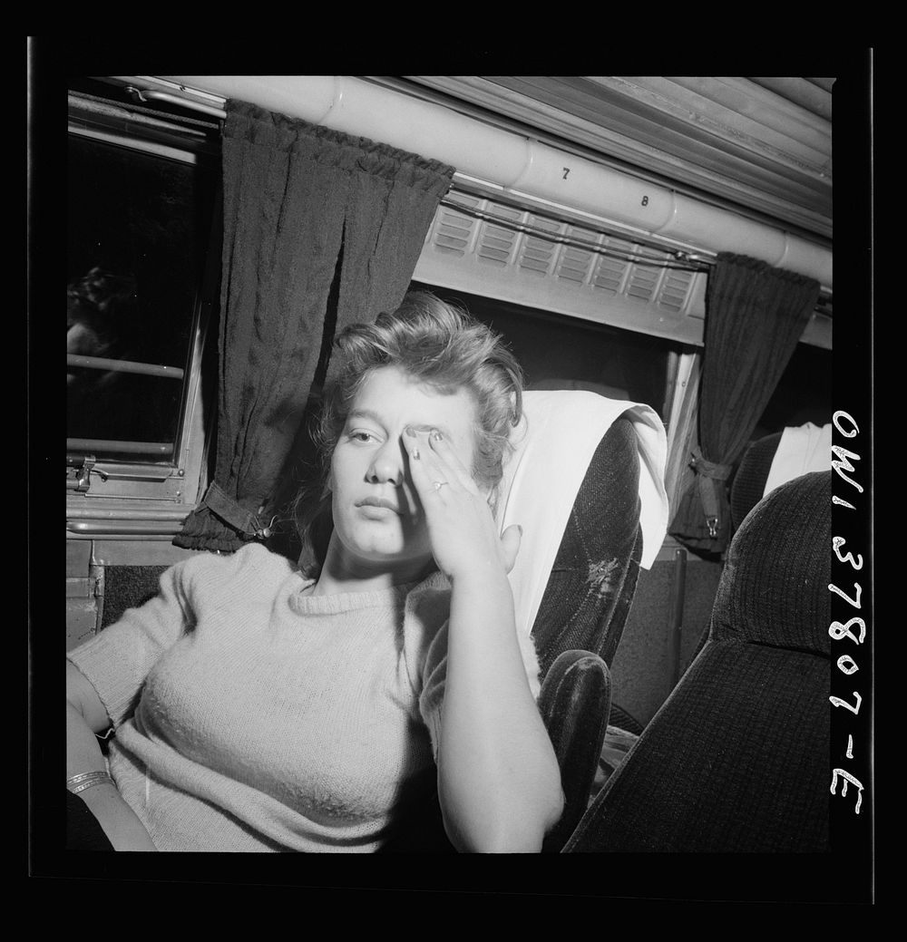 Chicago, Illinois. A girl passenger waking up as the Greyhound bus comes into the city. She came from Knoxville, Tennessee…