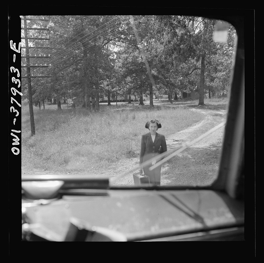 A Greyhound bus trip from Louisville, Kentucky, to Memphis, Tennessee, and the terminals. Girl waiting for bus by road's…