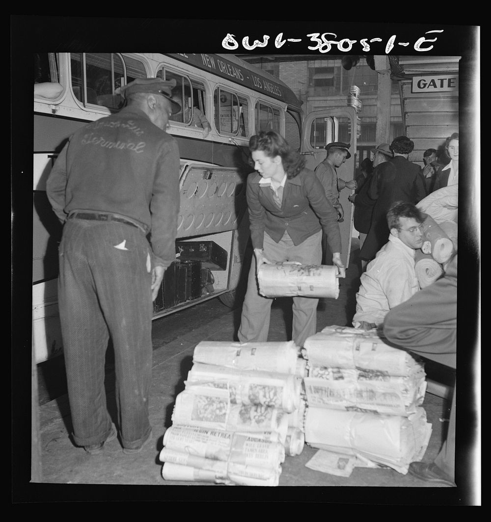 Bus trip from Knoxville, Tennessee to Washington, D.C. Girl baggage clerk loading newspapers onto a bus at Knoxville…