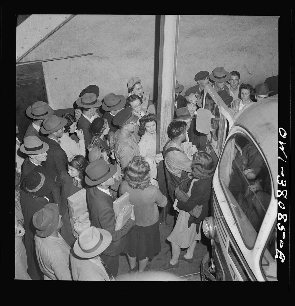 Bus trip from Knoxville, Tennessee, to Washington, D.C. Passengers boarding bus at Knoxville. Sourced from the Library of…