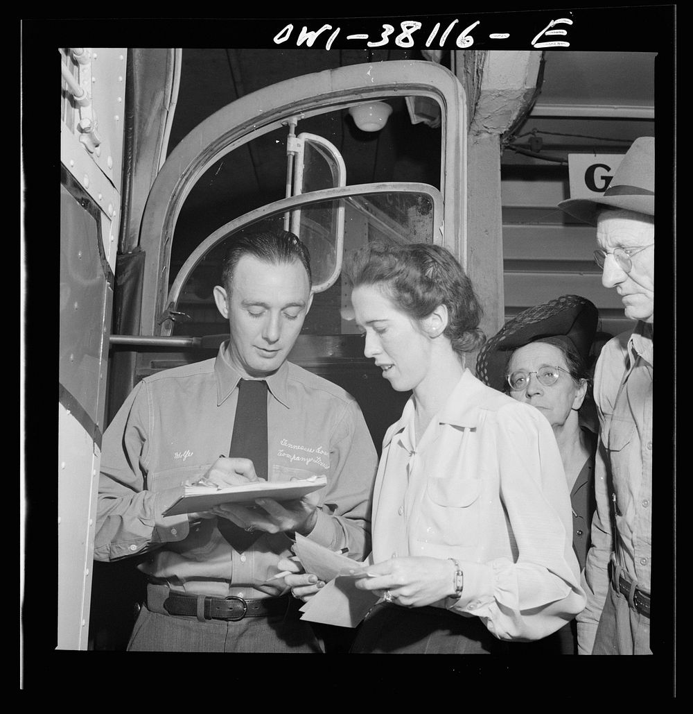 Bus trip from Knoxville, Tennessee, to Washington, D.C. Bus driver signing for manifest baggage which has been loaded on his…