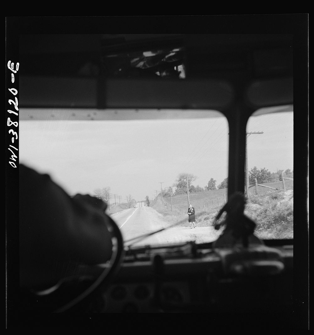 Bus trip from Knoxville, Tennessee, to Washington, D.C. Woman waiting for bus on highway in Tennessee. Sourced from the…