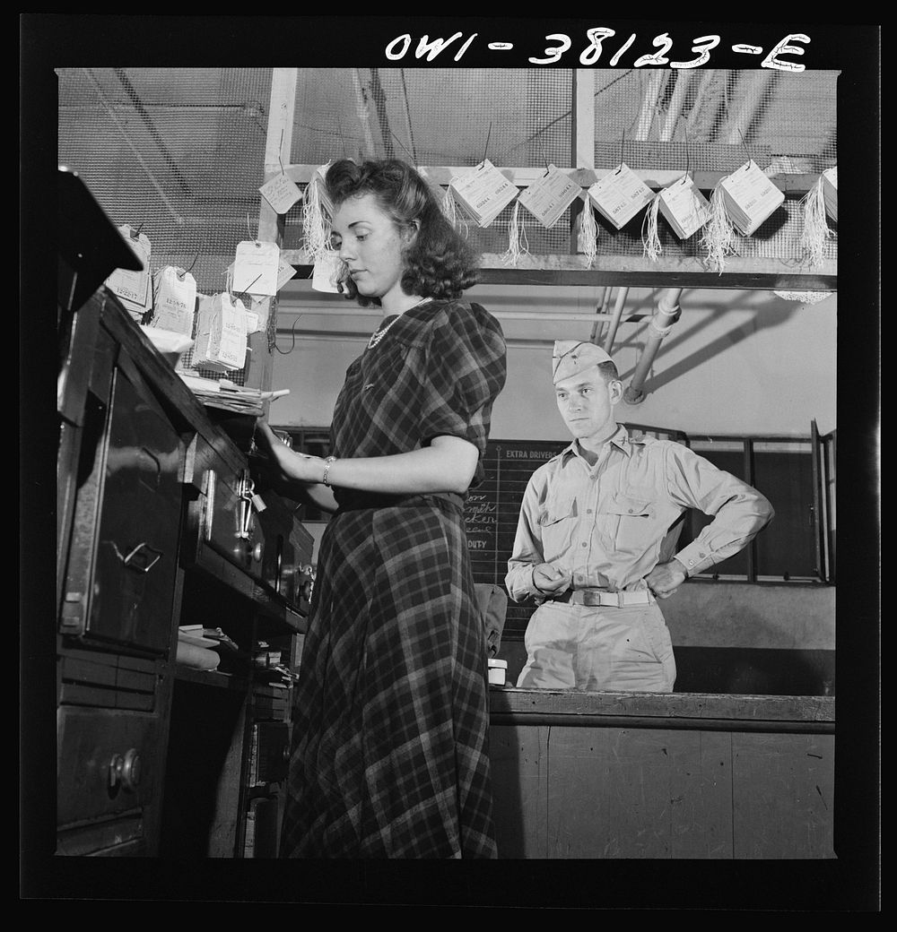 Bus trip from Knoxville, Tennessee, to Washington, D.C. Girl agent checking bag at Knoxville. Sourced from the Library of…