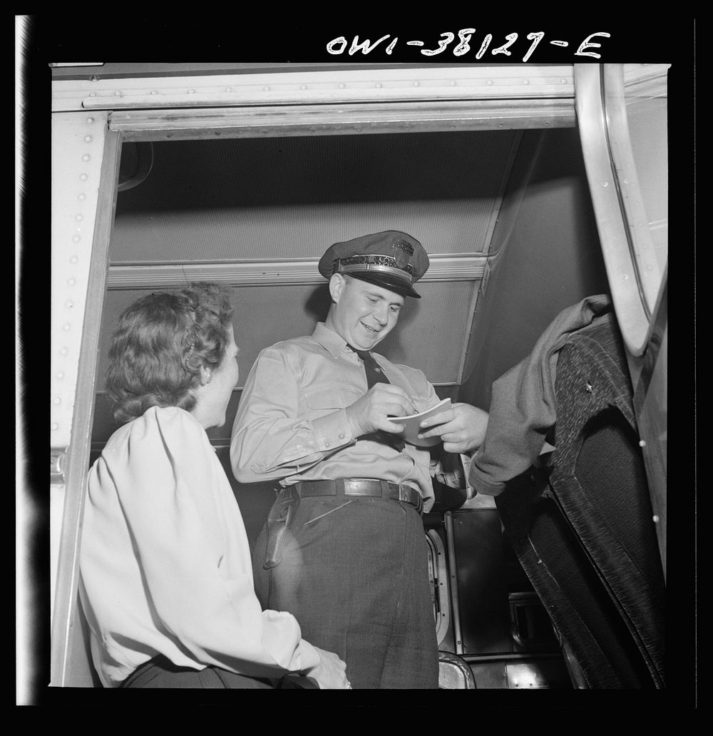 Bus trip from Knoxville, Tennessee, to Washington, D.C. Bus driver signing for manifest baggage which has been loaded on his…