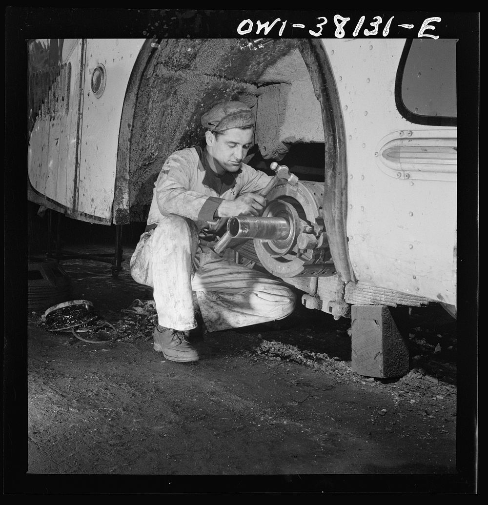 Bus trip from Knoxville, Tennessee, to Washington, D.C. Knoxville, Tennessee. A mechanic working on a brake lining at the…