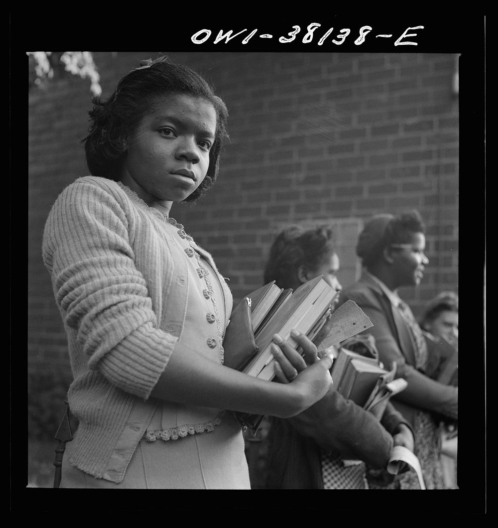 Bus trip from Knoxville, Tennessee, to Washington, D.C. Schoolgirl waiting to get on bus at small town in Tennessee. Sourced…