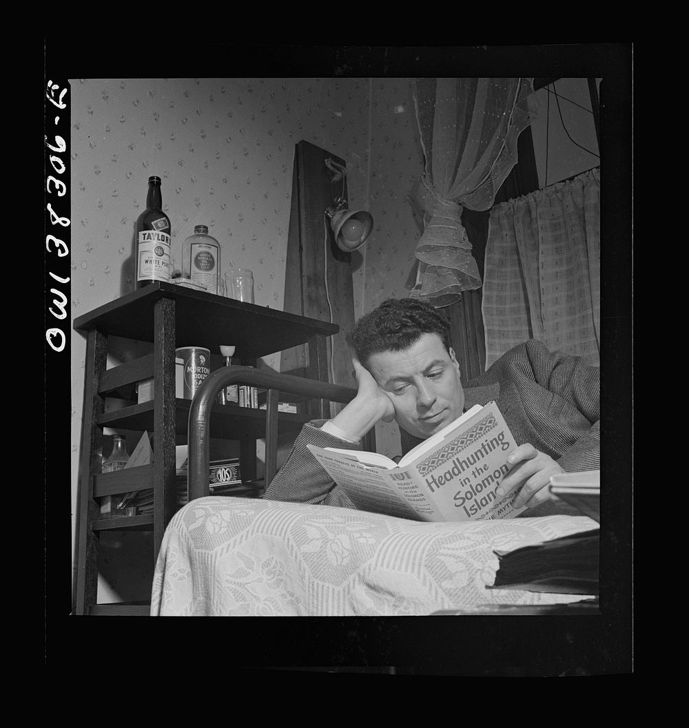 Washington, D.C. A clerk in the U.S. Navy Department reading in his room in a boardinghouse. Sourced from the Library of…