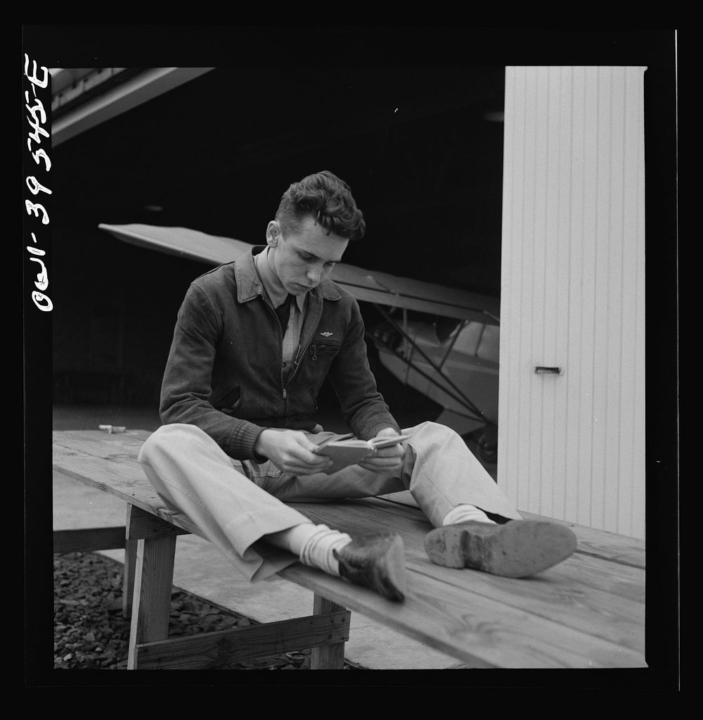 Frederick, Maryland. Walter Spangenberg, a student at Woodrow Wilson High School, studying his English lesson while waiting…
