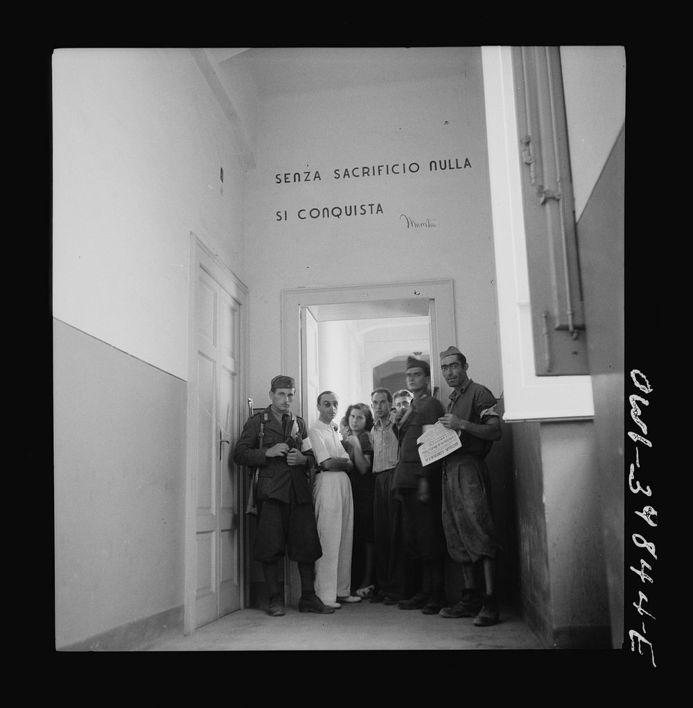 Lineup outside an Allied military government office in Sicily. Sourced from the Library of Congress.