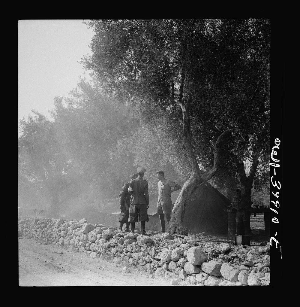 An Italian policeman passing the time of day with a British soldier in Sicily. Sourced from the Library of Congress.