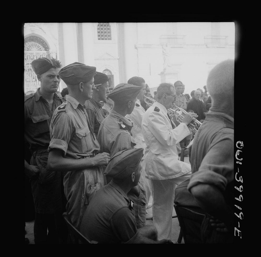 Palermo, Sicily. Allied soldiers listening to concert given for them by Palermo symphony orchestra and local vocal artists.…
