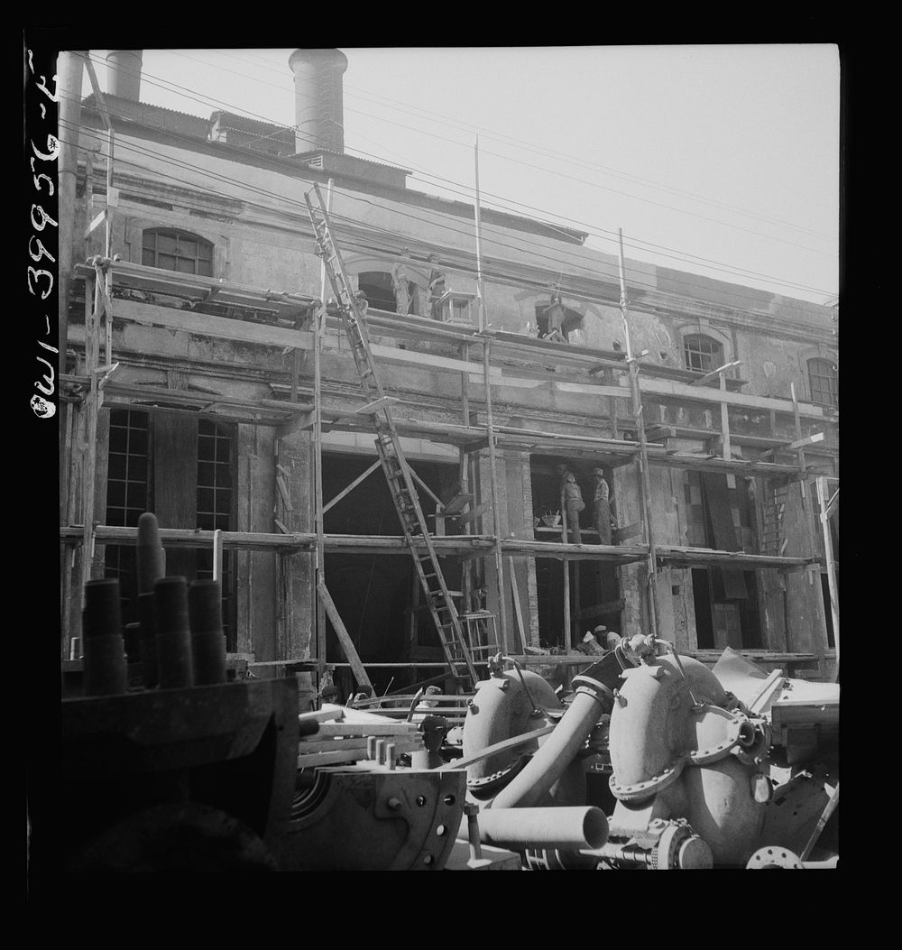 Catania, Sicily. Rebuilding the city. The Allied government is paying a wage comparable with peacetime for the labor. This…