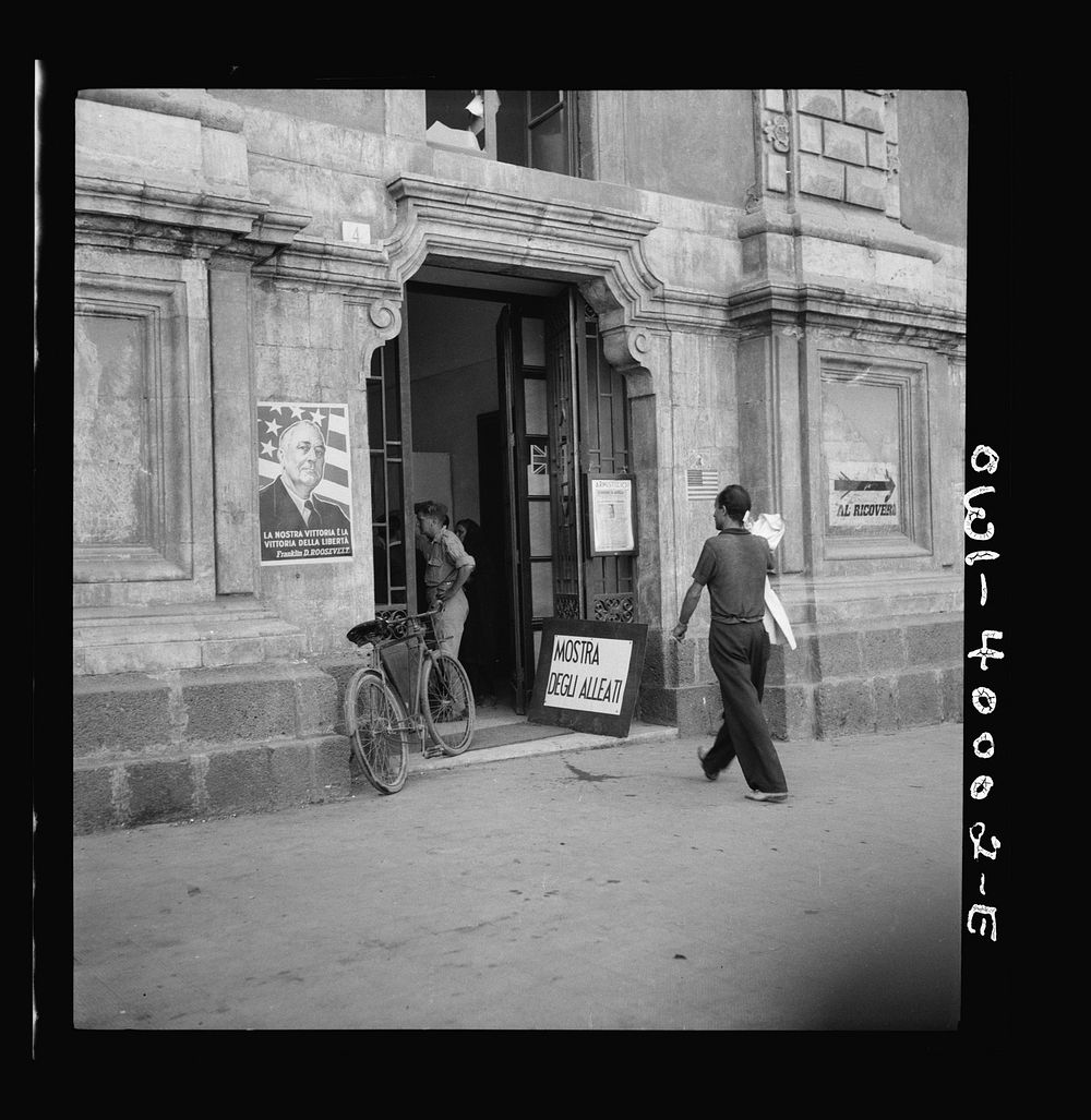 Catania, Sicily. Entrance to an exhibition on the allied cause, probably prepared by the United States Office of War…