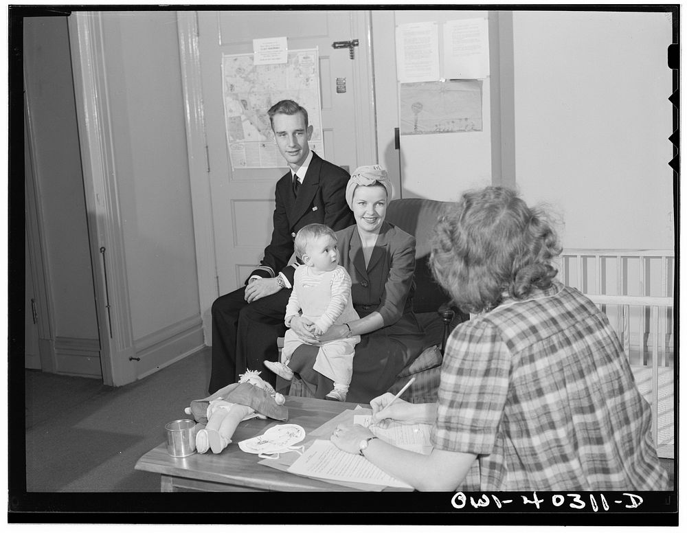Washington, D.C. A naval officer and his wife leaving instructions for the care of their child whom they are leaving in the…