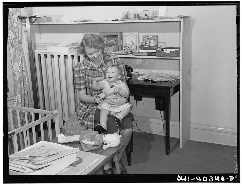 [Untitled photo, possibly related to: Washington, D.C. A child in the nursery at the United Nations service center trying to…