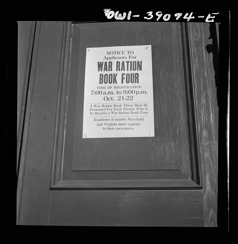 [Untitled photo, possibly related to: A sign in front of Woodrow Wilson High School on the day when number four ration books…
