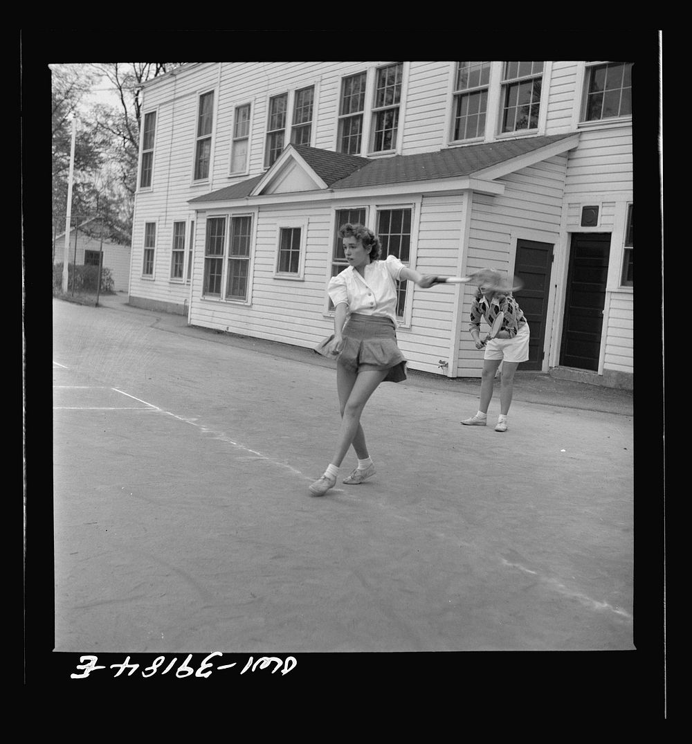 Washington, D.C. Sally Dessez, a student at Woodrow Wilson High School, playing a tennis match. Sourced from the Library of…