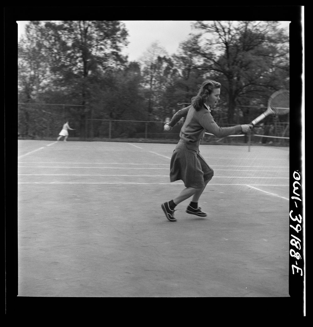 [Untitled photo, possibly related to: Washington, D.C. A Woodrow Wilson High School student playing tennis at a court near…