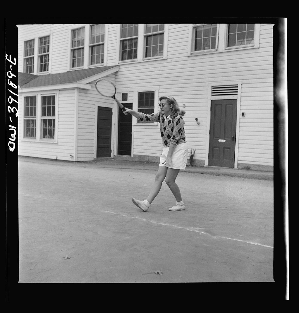 Washington, D.C. A Woodrow Wilson High School student playing tennis at a court near the school. Sourced from the Library of…