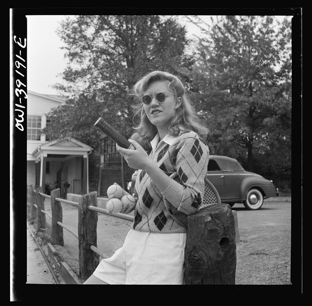 Washington, D.C. A Woodrow Wilson High School student waiting to use a tennis court. Sourced from the Library of Congress.