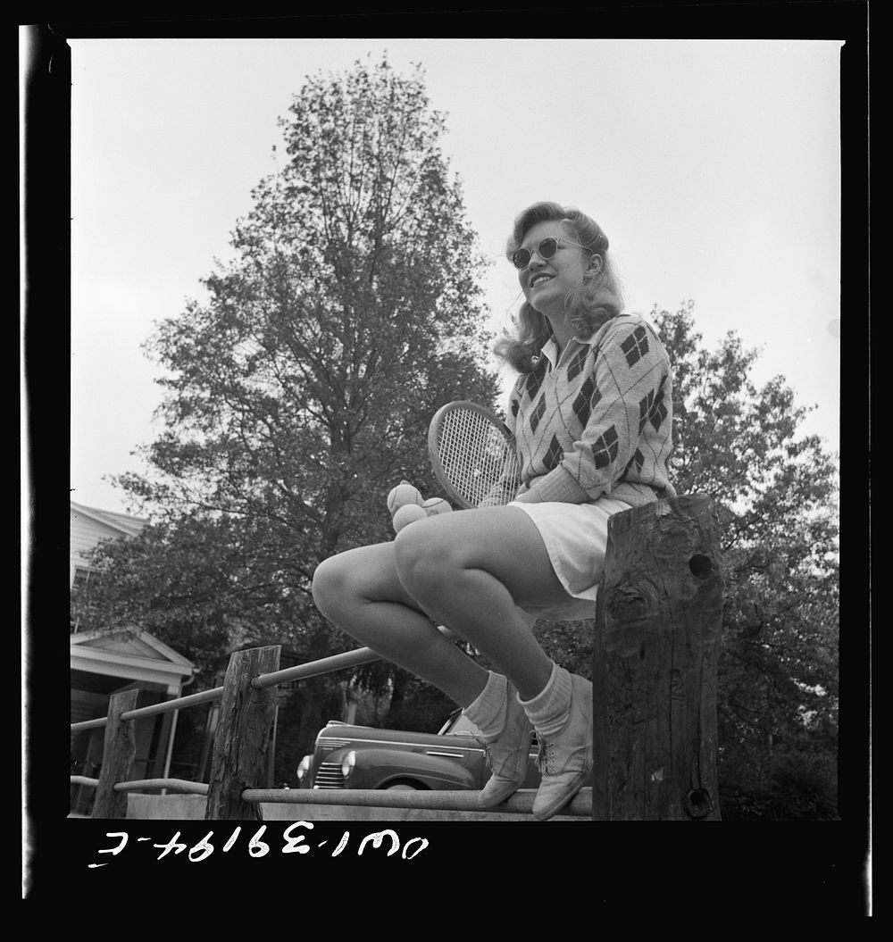 Washington, D.C. A Woodrow Wilson High School student waiting to use a tennis court. Sourced from the Library of Congress.